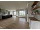 Bright and airy living room featuring hardwood floors, modern ceiling fan, and plenty of natural light at 25 Deer Tail Ln # 52, Fuquay Varina, NC 27526