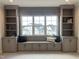 Cozy window seat with built-in bookshelves adds charm to this neutral-toned living space at 25 Deer Tail Ln # 52, Fuquay Varina, NC 27526