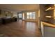 Open concept living room with hardwood floors, natural light, and a seamless transition to the kitchen and dining areas at 25 Deer Tail Ln # 52, Fuquay Varina, NC 27526