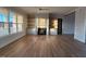 Bright and airy living room featuring hardwood floors, custom built-in shelving, and a cozy fireplace at 25 Deer Tail Ln # 52, Fuquay Varina, NC 27526