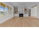 Bright living room features a fireplace with custom built-ins and beautiful hardwood floors, creating a cozy atmosphere at 25 Deer Tail Ln # 52, Fuquay Varina, NC 27526