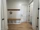 Functional mudroom featuring a built-in bench with storage cubbies and coat hooks at 25 Deer Tail Ln # 52, Fuquay Varina, NC 27526