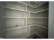 Walk-in pantry with custom shelving at 25 Deer Tail Ln # 52, Fuquay Varina, NC 27526