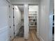 Combination laundry and pantry area with washer/dryer and floor-to-ceiling shelving at 25 Deer Tail Ln # 52, Fuquay Varina, NC 27526
