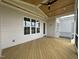Covered porch features wood plank flooring and ceiling fan at 25 Deer Tail Ln # 52, Fuquay Varina, NC 27526