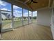 Inviting screened porch with wood ceiling and floors perfect for outdoor relaxation and entertaining at 25 Deer Tail Ln # 52, Fuquay Varina, NC 27526