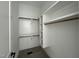 Bright walk-in closet with built in shelving and hanging rods. Flooring still under construction at 25 Deer Tail Ln # 52, Fuquay Varina, NC 27526