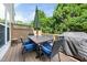 Outdoor deck featuring patio furniture, umbrella and grill, perfect for entertaining at 2506 Blooming St, Raleigh, NC 27612