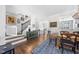 Light and bright entryway open to the dining room and stairway with wood floors at 2506 Blooming St, Raleigh, NC 27612