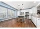 Bright kitchen with white cabinets, stainless steel appliances, and a center island at 2506 Blooming St, Raleigh, NC 27612