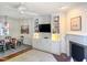 Bright living room showcasing the fireplace, built-in shelving and media center at 2506 Blooming St, Raleigh, NC 27612