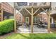 Relaxing outdoor patio with comfortable seating and well-maintained lawn and landscaping at 2506 Blooming St, Raleigh, NC 27612