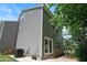 Backyard featuring a home's exterior, a tidy lawn, and trees for relaxing outdoor enjoyment at 2513 Magnolia Tree Ln, Durham, NC 27703