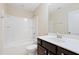 Bathroom features a shower-tub combination and vanity, blending style with practical functionality at 2513 Magnolia Tree Ln, Durham, NC 27703