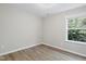 Well-lit bedroom featuring a window for natural light and light-toned walls at 2513 Magnolia Tree Ln, Durham, NC 27703