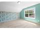 Large bedroom with floral accent wall and large window with a view at 2513 Magnolia Tree Ln, Durham, NC 27703