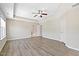 Open Primary bedroom with wood flooring, tray ceilings, recessed lights, and large windows at 2513 Magnolia Tree Ln, Durham, NC 27703