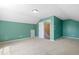 Bedroom showcases sloped ceilings and neutral carpet, with an adjacent doorway at 2513 Magnolia Tree Ln, Durham, NC 27703