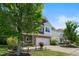 Charming two-story home featuring a stone-accented facade, two-car garage, and a beautifully landscaped front yard at 2513 Magnolia Tree Ln, Durham, NC 27703