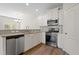 Modern kitchen boasts stainless steel appliances, granite countertops, and white cabinetry at 2513 Magnolia Tree Ln, Durham, NC 27703