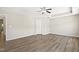 Large main bedroom with ceiling fan and trey ceiling; light-filled with wood-look flooring at 2513 Magnolia Tree Ln, Durham, NC 27703