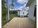 Relax on the back deck with views of the backyard and landscaping, surrounded by mature trees and a beautiful sky at 269 Deer Tail Ln # 44, Fuquay Varina, NC 27526