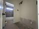 Modern bathroom featuring a soaking tub with sleek gray tiling, showcasing contemporary design at 269 Deer Tail Ln # 44, Fuquay Varina, NC 27526