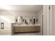 The bathroom boasts a marble floor, triple vanity, and a frameless glass shower offering a luxurious experience at 269 Deer Tail Ln # 44, Fuquay Varina, NC 27526