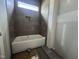Unfinished bathroom features a modern tub and tiled wall at 269 Deer Tail Ln # 44, Fuquay Varina, NC 27526