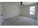 Unfinished bedroom with a large window providing natural light, complemented by neutral walls and trim at 269 Deer Tail Ln # 44, Fuquay Varina, NC 27526