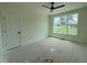 Bright, unfinished bedroom with a large window offering serene outdoor views and a ceiling fan at 269 Deer Tail Ln # 44, Fuquay Varina, NC 27526