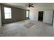 Spacious bedroom featuring paneled accent wall, neutral paint, and a modern ceiling fan at 269 Deer Tail Ln # 44, Fuquay Varina, NC 27526