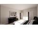 Bright bedroom with a large bed, dresser, and a modern artwork at 269 Deer Tail Ln # 44, Fuquay Varina, NC 27526