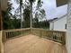 Wooden deck overlooking a yard with mature trees, perfect for outdoor gatherings at 269 Deer Tail Ln # 44, Fuquay Varina, NC 27526