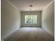 Dining room featuring an ornate light fixture and large bright windows at 269 Deer Tail Ln # 44, Fuquay Varina, NC 27526