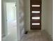 Stylish entryway features a modern front door with glass panels and a view into another room at 269 Deer Tail Ln # 44, Fuquay Varina, NC 27526