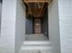 Inviting entryway featuring a modern wood door with sidelights and white brick columns at 269 Deer Tail Ln # 44, Fuquay Varina, NC 27526
