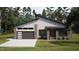 Modern exterior with horizontal siding and a dark gray garage door at 269 Deer Tail Ln # 44, Fuquay Varina, NC 27526