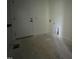 Laundry room featuring modern door, ready for future washer and dryer hookups and storage at 269 Deer Tail Ln # 44, Fuquay Varina, NC 27526