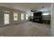 Spacious living room with fireplace, built-in shelves, and glass doors leading to the deck at 269 Deer Tail Ln # 44, Fuquay Varina, NC 27526