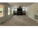 Large living room boasting a fireplace, built-in shelving, and big windows offering views of outdoors at 269 Deer Tail Ln # 44, Fuquay Varina, NC 27526