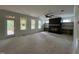 Spacious living room with a fireplace, fan, built-in shelves, and natural light at 269 Deer Tail Ln # 44, Fuquay Varina, NC 27526