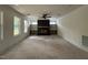 Bright living room with fireplace, built-in shelves, fan, and natural light at 269 Deer Tail Ln # 44, Fuquay Varina, NC 27526
