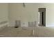 Spacious living room with white walls and ceiling awaiting finishing touches at 269 Deer Tail Ln # 44, Fuquay Varina, NC 27526