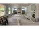 Spacious living room with fireplace, built-in shelves and many windows being remodeled at 269 Deer Tail Ln # 44, Fuquay Varina, NC 27526