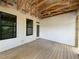 New wood porch showing white siding and black trimmed windows at 269 Deer Tail Ln # 44, Fuquay Varina, NC 27526