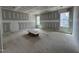 Room being remodeled with drywall hung on the walls and ceiling, featuring multiple windows at 269 Deer Tail Ln # 44, Fuquay Varina, NC 27526