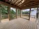 Expansive screened porch with natural wood and views of lush greenery, ideal for relaxation and entertainment at 269 Deer Tail Ln # 44, Fuquay Varina, NC 27526