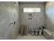 Contemporary tiled shower with niche, bench seat, and river rock floor, creating a spa-like experience at 269 Deer Tail Ln # 44, Fuquay Varina, NC 27526