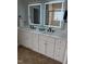 Modern bathroom with double vanity, custom cabinets, and stylish lighting at 2833 Praire View Pt, Wendell, NC 27591